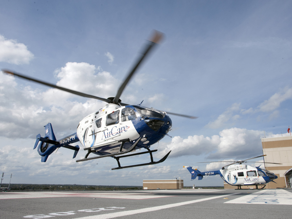 AirCare1 and 2 on the helipad located atop the Conerly Critical Care Hospital.