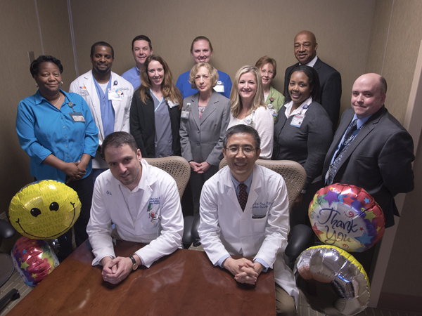 Members of the AWARDS Team, standing from left, are Yvette Galloway, Driscoll Devaul, David Keeney, Maria Smith, Connie Suber, Megan Wylie, Cammie Breedlove, Charlotte Cockrell, Gladys Peters, Terrence Shirley and Chris Morgan. Seated, from left, are Markovich and Yang.