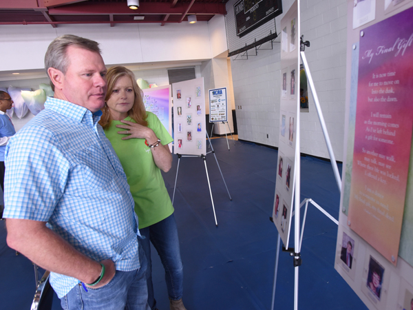 Jackson couple David and Sheila Wilbanks look at posters bearing the photos of organ donors, including their son Walker Wilbanks.