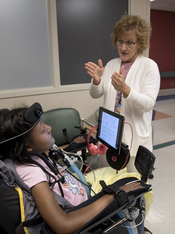 Teacher Kathy Doonan helps DeAsia Scott with a math lesson.