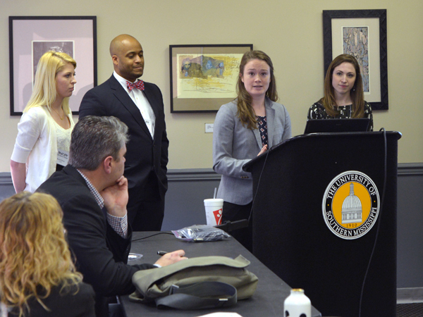 Rachel Sharp (left, standing), Jedd Audry, Lauren Williamson and Mary Ball Markow, students of Dr. Ralph Didlake, present "The lost art of medicine: archiving as a novel learning experience."