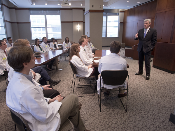 Gov. Phil Bryant talks with UMMC medical students during Capitol Day Tuesday, encouraging them to practice in Mississippi and reach out to patients through the use of telehealth technology. Bryant and his wife, Deborah Bryant, are frequent visitors to Batson Children's Hospital, and he shared his vision for an expanding medical zone in Jackson.