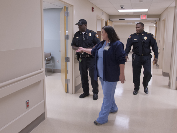 Elizabeth Adcock, manager of performance improvement at UMMC Holmes County, shows off the Lexington hospital's new Emergency Department to Lexington Police Department investigator John Newton (left) and Chief Robert Kirkland Sr.