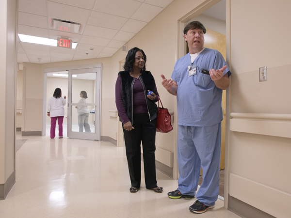 Eddie Holman (right), X-ray supervisor at UMMC Holmes County, explains services offered in the Lexington hospital's new Emergency Department to Charlie Joiner, the Holmes County administrator.