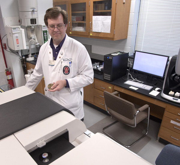 Dr. Jason Griggs uses a micro-CT scanner to analyze samples from the Department of Civil Engineering at UM.