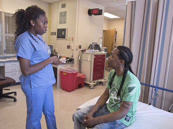 Hickman chats with Melton during a visit to the new clinic.