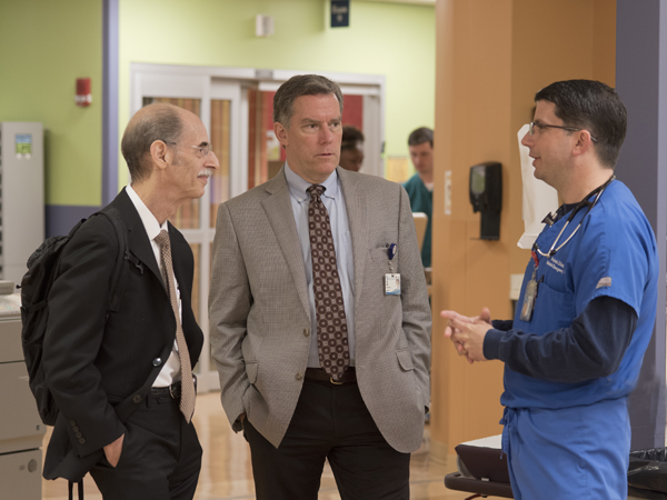 Dreyer, left, talks with Dr. Rick Barr, Suzan B. Thames Professor and chair of pediatrics at UMMC, and Dr. Benjamin Dillard, right, professor of pediatric emergency medicine, while touring the pediatric emergency department Thursday.