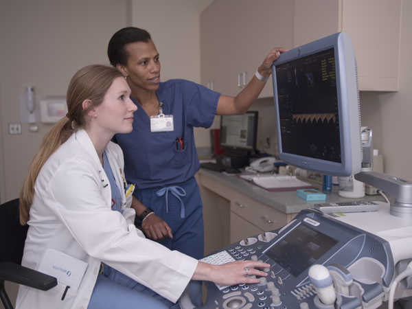 Hannah Rice, left, an M3, studies an ultrasound with Dr. Michelle Owens, associate professor of obstetrics and gynecology