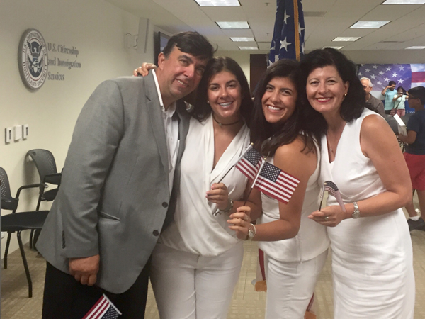 Sara Kiparizoska, second from right, congratulates her parents, Zan Kiparizoski and Gordana Kiparizoska and sister Eva Kiparizoska immediately after their naturalization ceremony in New Orleans.