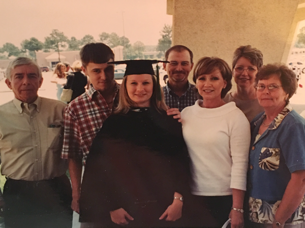 At her School of Medicine commencement ceremony in 2003, Shoemake is congratulated by her family -- from left, father Paul Shoemake, brother Blake Alford, uncle Richard Murphree, mother June Alford, aunt Bobbie Murphree and grandmother Laneita Murphree.