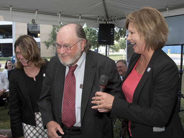 Among those who addressed the crowd gathered on Sept. 19, 2016  to celebrate the naming of the John D. Bower School of Population Health, are, from left, Anne Travis, daughter of the honoree and Bower Foundation CEO ; Dr. John Bower; and Dr. LouAnn Woodward, vice chancellor for health affairs.