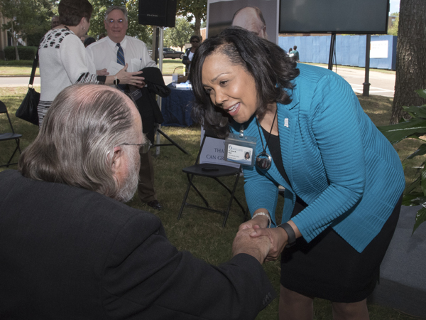 Dr. Bettina Beech, founding dean of UMMC's new John D. Bower School of Population Health, greets the school's namesake.