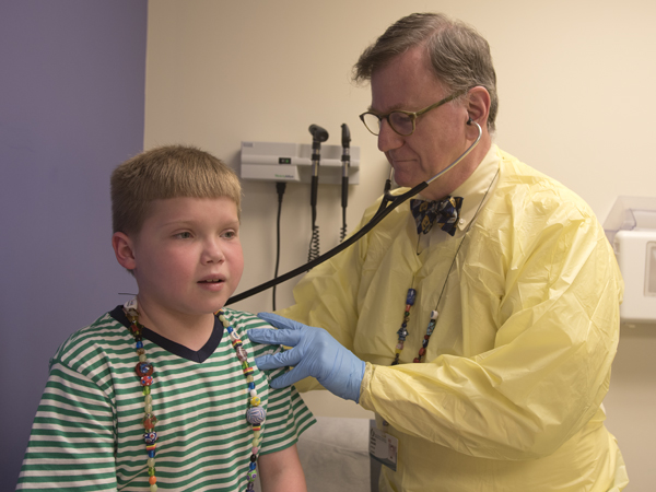 Dr. Marc Majure listens to Braeden's breathing during his appointment at the Eli Manning Children's Clinics at Batson Children's Hospital.