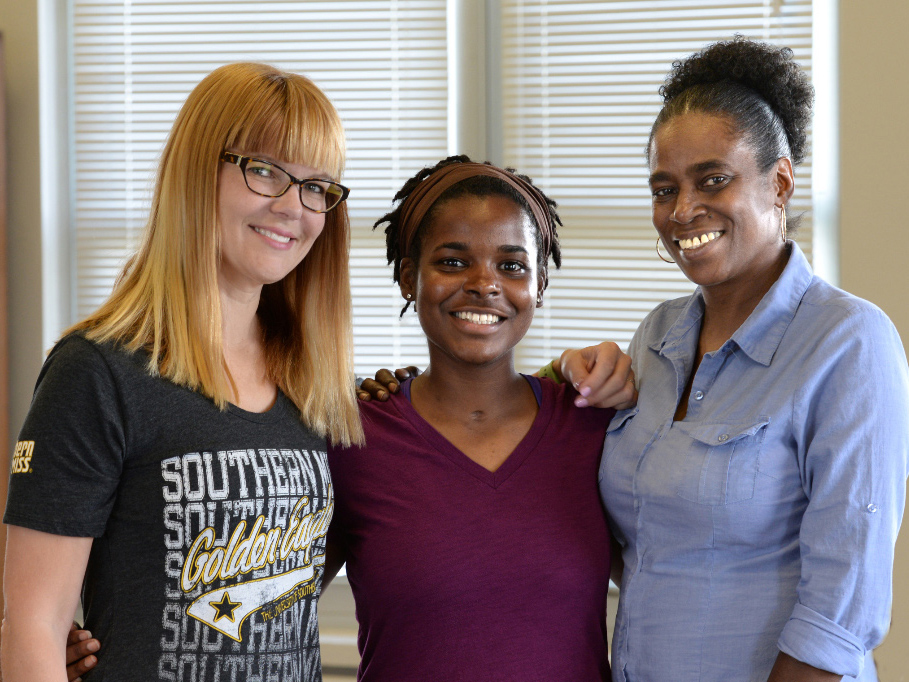 Whiteside, center, had two strong women advocating for her recovery: Dr. Amy Chasteen Miller, left, her academic advisor at the University of Southern Mississippi, and her mother, Angela Whiteside.