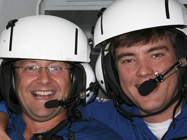 Dr. Damon Darsey, right, was an AirCare paramedic before leaving to go to medical school. Also in this photo taken more than a decade ago is veteran AirCare nurse Bo Sullivan.