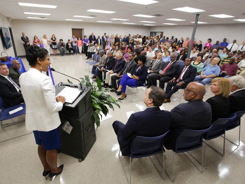 Dr. Tonya Moore, administrator of community health services for UMMC’s Center for Telehealth, welcomes a standing-room only crowd to the ribbon cutting for the Community Care Clinic.