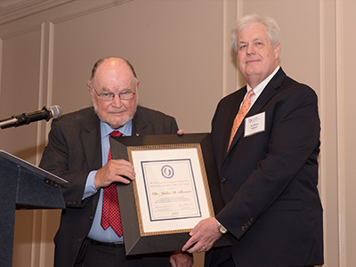 Bower accepts his certificate from Longest.