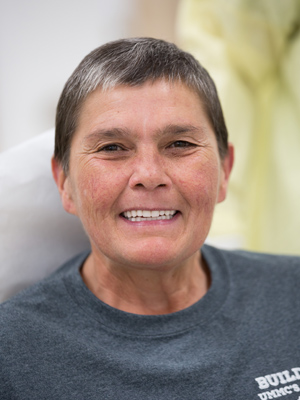 Chaffin smiles, showing off her new teeth.