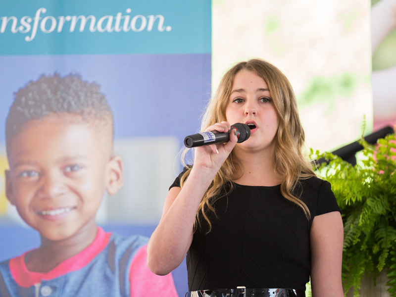 Mary Ellis Cravey, a Children's Cancer Center patient and leukemia survivor, sings "What A Wonderful World" during the groundbreaking ceremony for a new children's tower at UMMC.