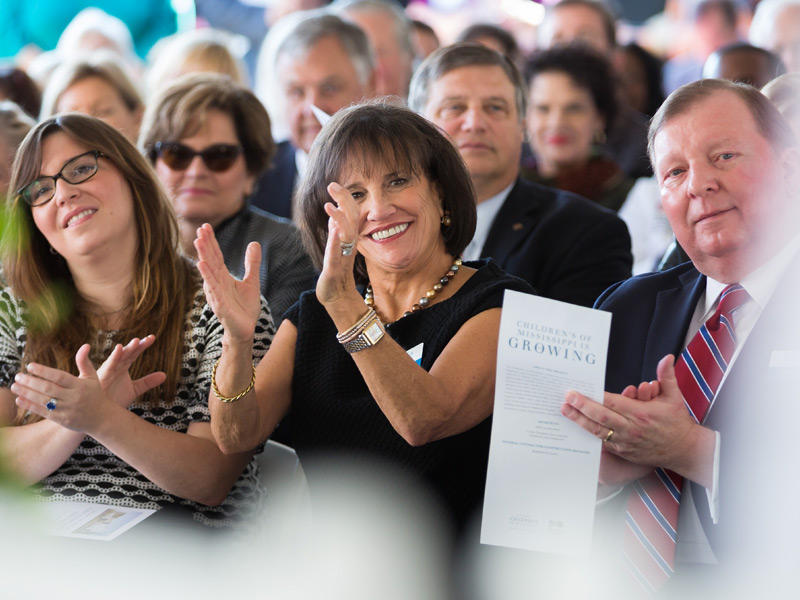 Cheering on the coming construction of a new children's tower at UMMC is Sara Ray, center, who was board chairman of Friends of Children's Hospital when the nonprofit pledged $20 million toward the construction.