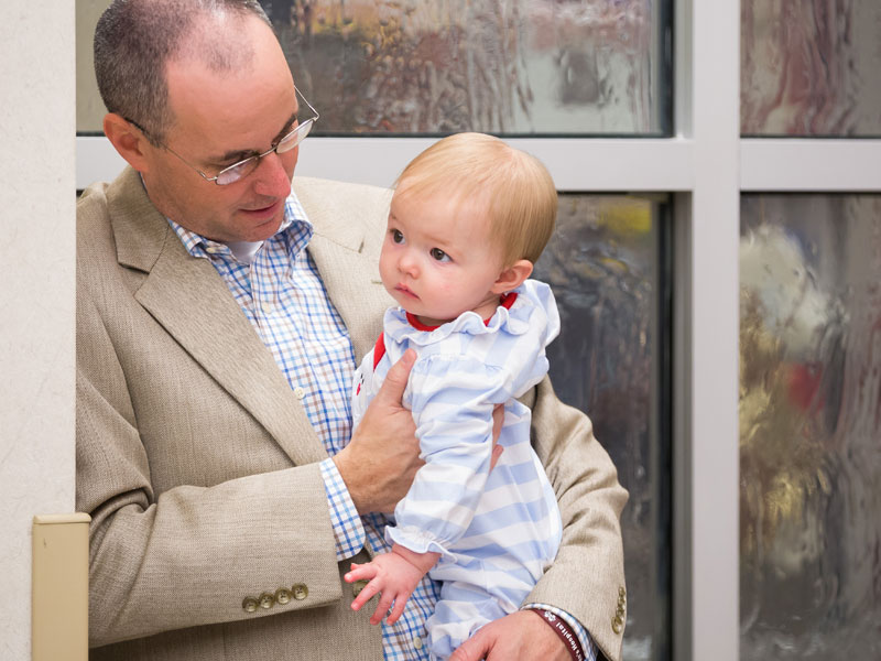 David Dale holds daughter Stella Grace at BankPlus Presents Light A Light.