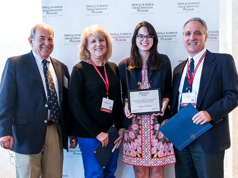 Salter, second from right, is congratulated by two of her mentors at the 2017 AACAP Annual Meeting: Bryant and Merideth, who are standing on either side of her. With them is Dr. Greg Fritz, outgoing AACAP president. (Photo courtesy of AACAP)