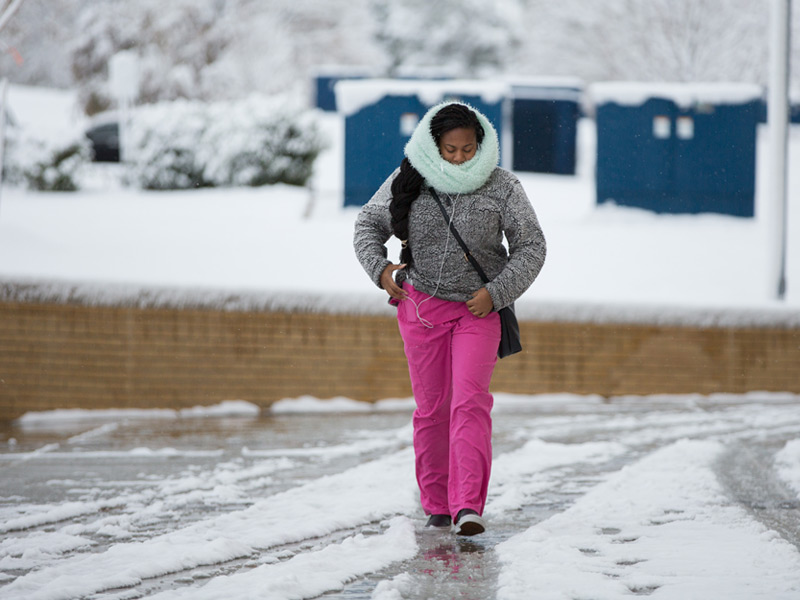 Shundria Washington, a patient service coordinator in the School of Dentistry, is bundled agains the cold while walking across the  UMMC campus on Friday.