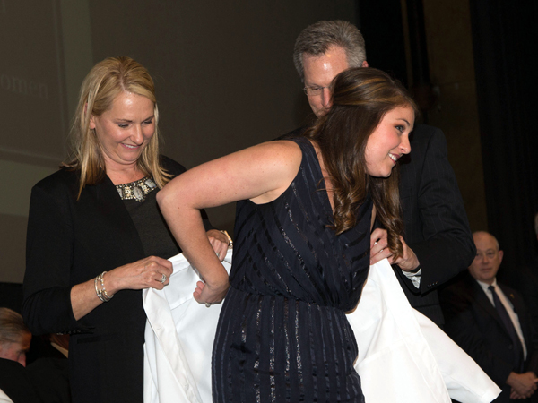 Meredith Lucas of Hattiesburg is coated by her parents, Dr. Melinda Lucas and Dr. Alan Lucas, both of whom are School of Dentistry alumni. Meredith's sister, Elizabeth, is in her first year of dental school at UMMC.