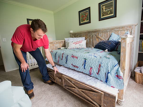 Backstrom shows a daybed he built for his son's room that includes a hide-a-way trundle.