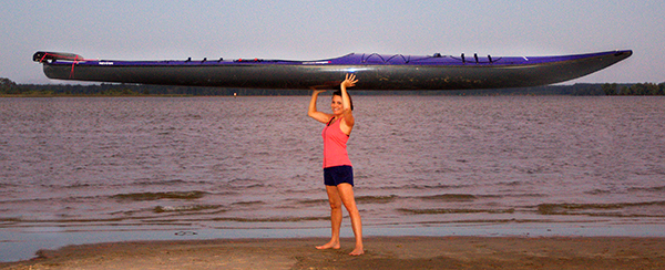 With a little help from friends, Richards hoists her 40-pound kayak.