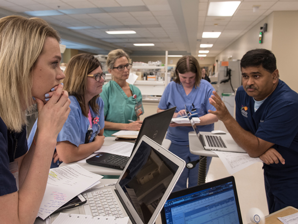 Taking part in rounds with neonatologists are, from left, Jones; Tanya Willis; Ann Adams, nursing supervisor; Dr. Amanda Capino, clinical assistant professor of pharmacy; and Dr. Abhay Bhatt, professor of neonatology.