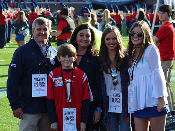 Felton Walker, wearing jersey No. 1, was the Children's of Mississippi Kid Captain during the Egg Bowl in Oxford. The Kid Captain Program honors pediatric patients and celebrates their inspiring stories. Also on the field for the ceremony are, from left, Chip Walker, Liz Walker, and Felton's sisters Mary Faser and Elizabeth.