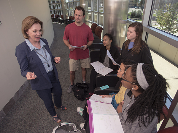 Bailey pauses to talk to students Chandler Rives, Kiara Dulaney, Megan Reed, Nina Nguyen and Millie Lloyd.