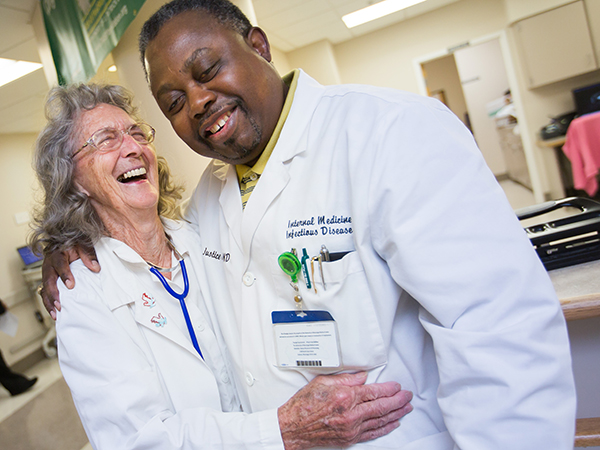 Cooley shares a laugh with Dr. Justice Gondwe.