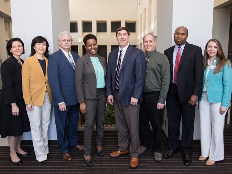 Bronze medallion recipients from left: Dr. Bernadette Grayson, Dr. Fan Fan, Dr. Junie Paula Warrington, Dr. Michael Hall, Dr. Douglas Vetter and Dr. Solomon Musani, with Dr. Richard Summers, third from left, and Leslie Musshafen, far right.