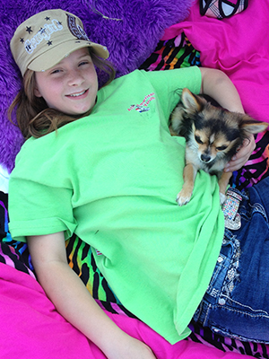 Carmen Smith, pictured with her dog Sasha, was a cheerleader.