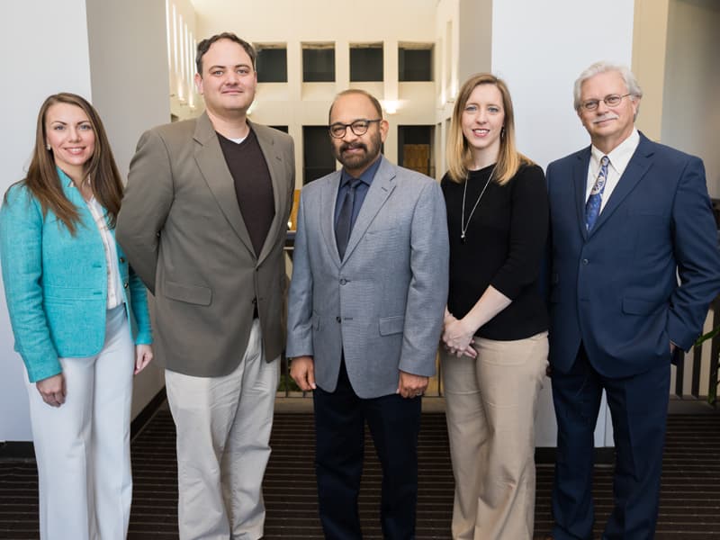 Discovery award winners starting second from left, Dr. Eric George, Dr. Parminder Vig and Connie Watson, with Musshafen and Summers.