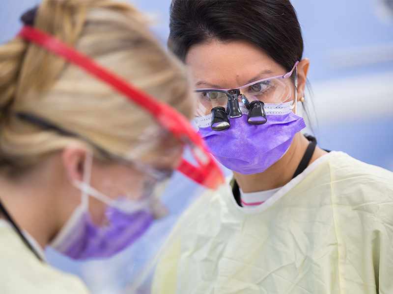 nstructor Cynthia Senior, right, watches, as Dental Hygiene student Brittany Chaisson performs preventive care on her mother, Rachel Chaisson, at the UMMC Dental School.