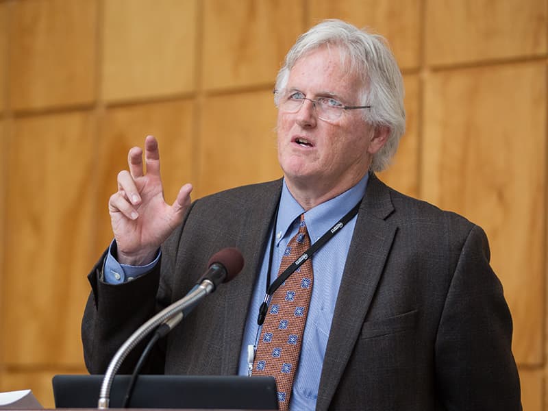 Dr. Robert Hester addresses the students at the school's annual Research Day.