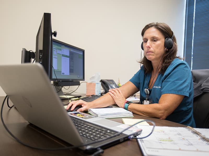 Nurse practitioner Lea Ann Coxwell cares for a patient via live, interactive video from the Ridgeland offices of UMMC's Center for Telehealth.