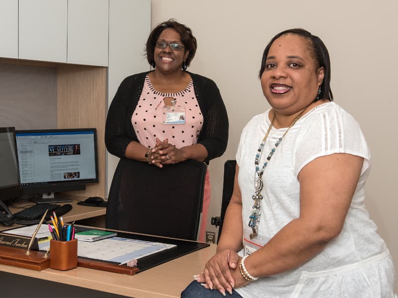Dr. Gaarmel Funches, right, director of the Office of Health Careers Opportunity, and LaFreda Sias, OHCO project manager, work together to recruit public and private school students for the office's many pipeline and enrichment programs.