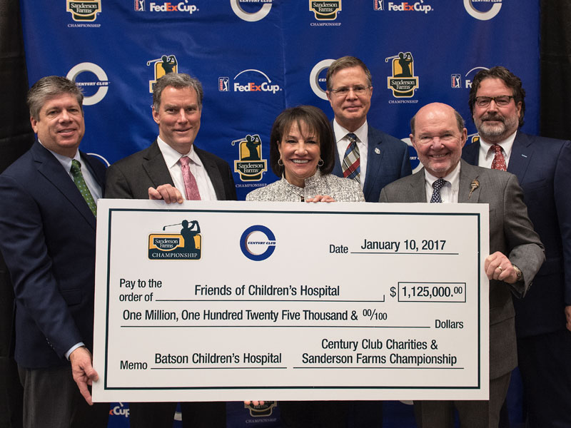 Revealing the record-setting donation of $1.125 million from Century Club Charities through the Sanderson Farms Championship are, from left, tournament executive director Steve Jent, UMMC former pediatrics chair Dr. Rick Barr, Friends of Children's Hospital former board chair Sara Ray, University of Mississippi Chancellor Dr. Jeffrey Vitter, board chairman and CEO of Sanderson Farms Joe Sanderson and Century Club Charities president Peter Marks.