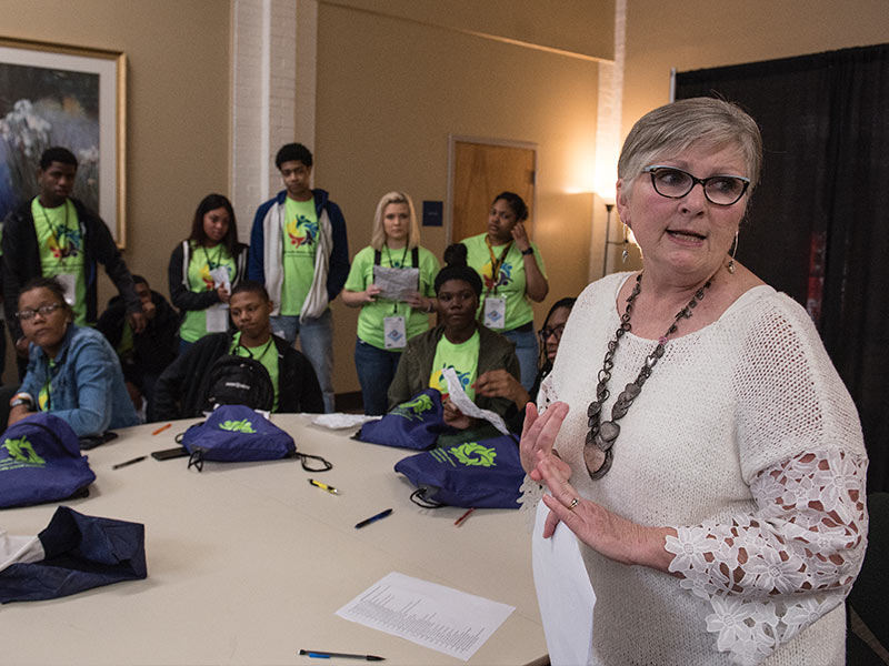 Dr. Kate Fouquier, UMMC associate professor of nursing and director of the Lanier High Teen Clinic, speaks to teens attending the Youth Health Matters Symposium about laws governing confidentiality of their health information.