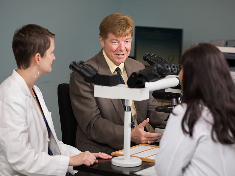 Allen believes the Department of Pathology can develop a national reputation. "We have good people to do that," he says. Among them are Dr. Kristen Adams, left, assistant professor of pathology, and Dr. Veena Shenoy, right, associate professor of pathology.