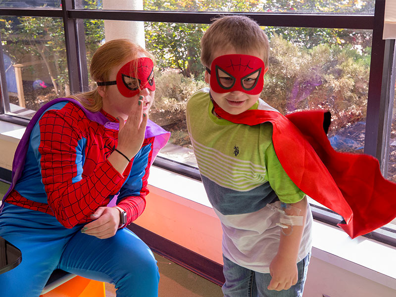 Spider-Man has a couple of helpers: Ole Miss softball player Izzy Werdann and Batson Children's Hospital patient Jase Thorpe of Brookhaven.