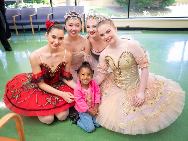 isiting Batson Children's Hospital, Taylor Carr of McComb smiles with Mississippi Metropolitan Ballet dancers, from left, Mattie Grace Morris of Brandon, Abigail McCaughan of Ridgeland, Josie Nasekos of Clinton and Taylor Binkley of Brandon.