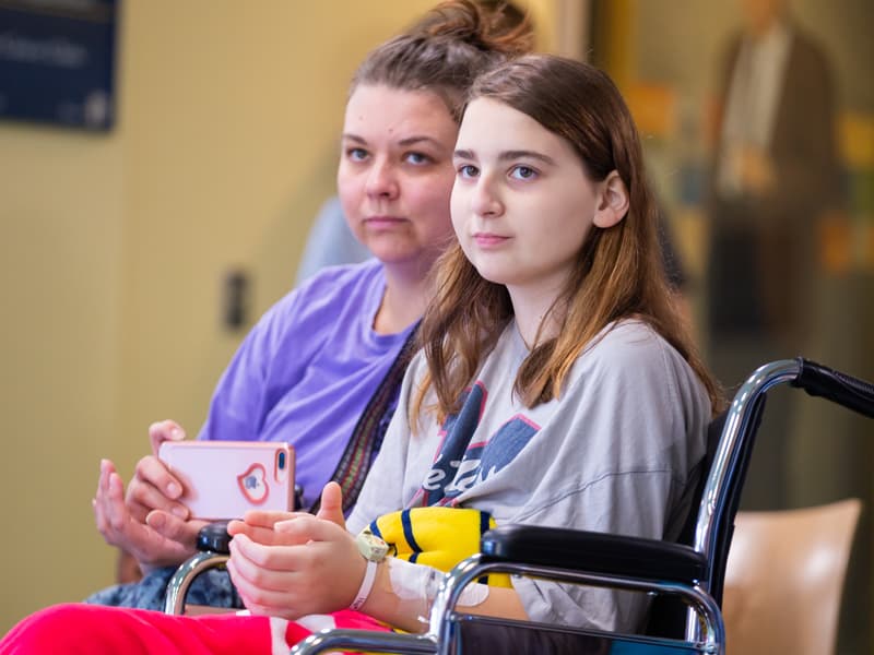 Heather Rayner of Brandon and daughter Juliana Sullivan, a Batson Children's Hospital patient, snap cell phone photos during the Mississippi Metropolitan Ballet's visit.