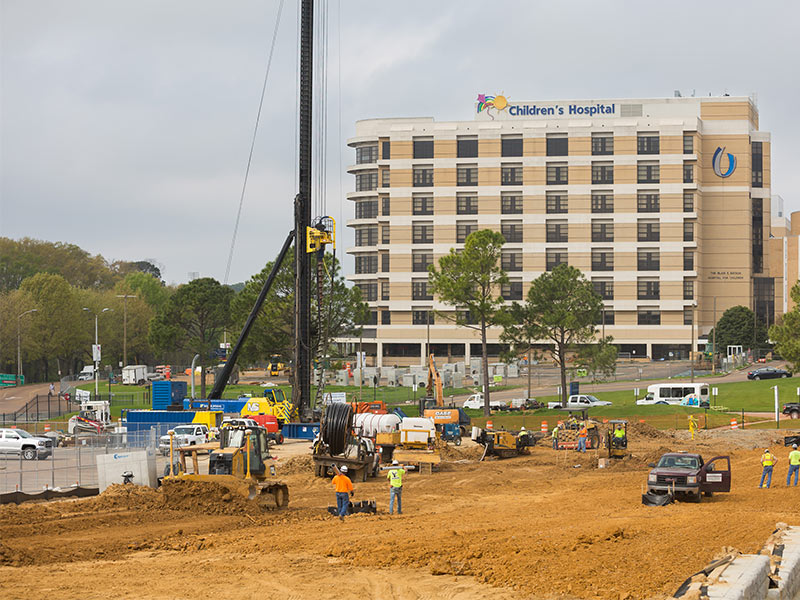 Construction of the new Children's tower is underway beginning with a new access road from East University Drive.