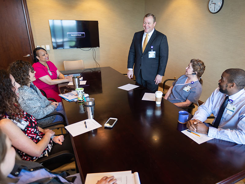 Adcock meets with Center for Telehealth team members at the center's headquarters in Ridgeland.