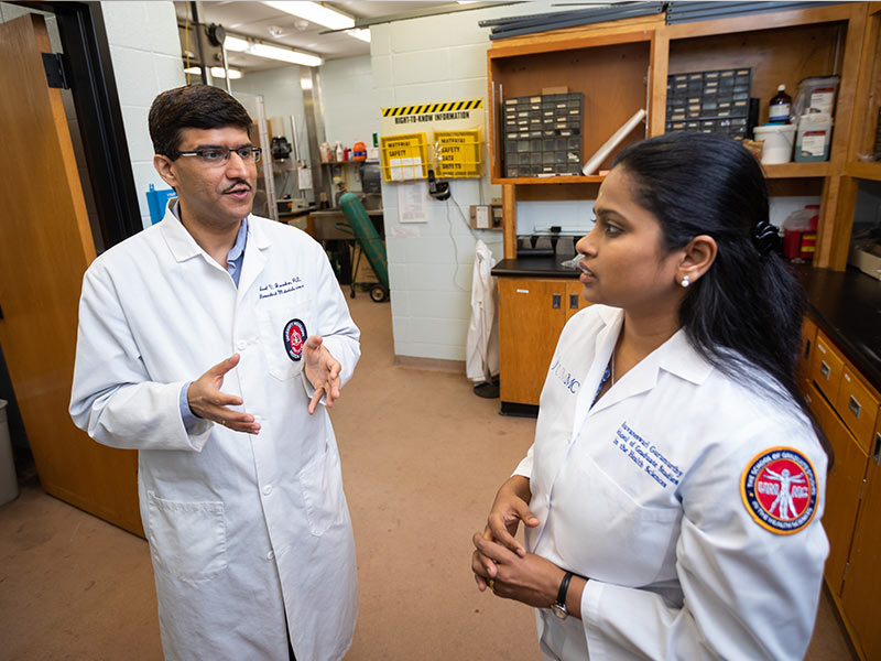 Janorkar, left, speaks with graduate assistant Bhuvaneswari Gurumurthy.